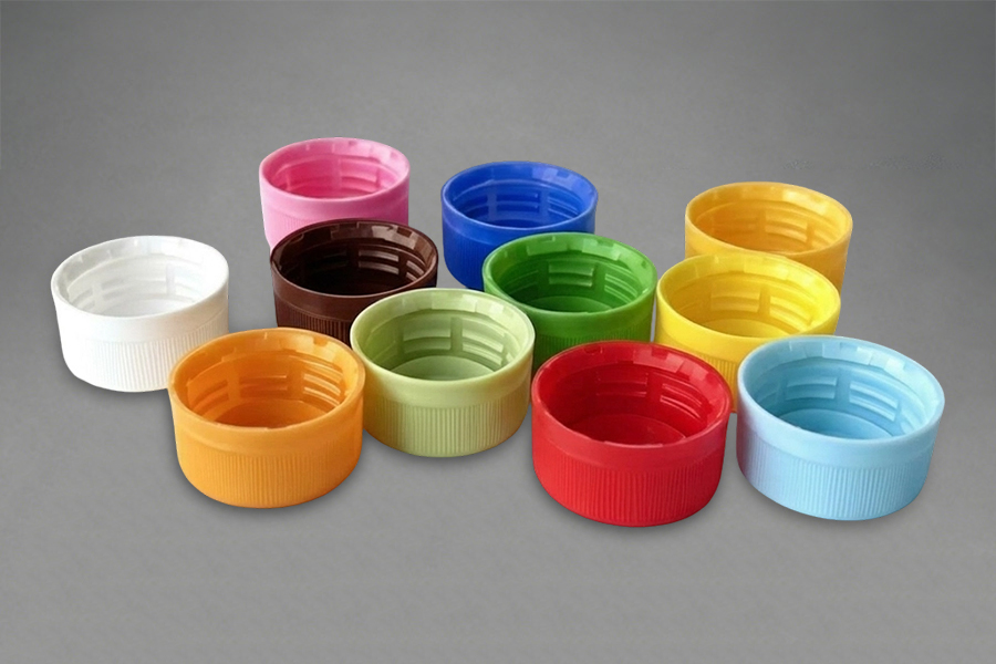 Tilpassede plastkapsler og -lukkinger
